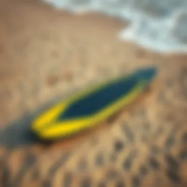 Electric Hydrofoil Surfboard on the Sand Top view of electric hydrofoil surfboard on the beach