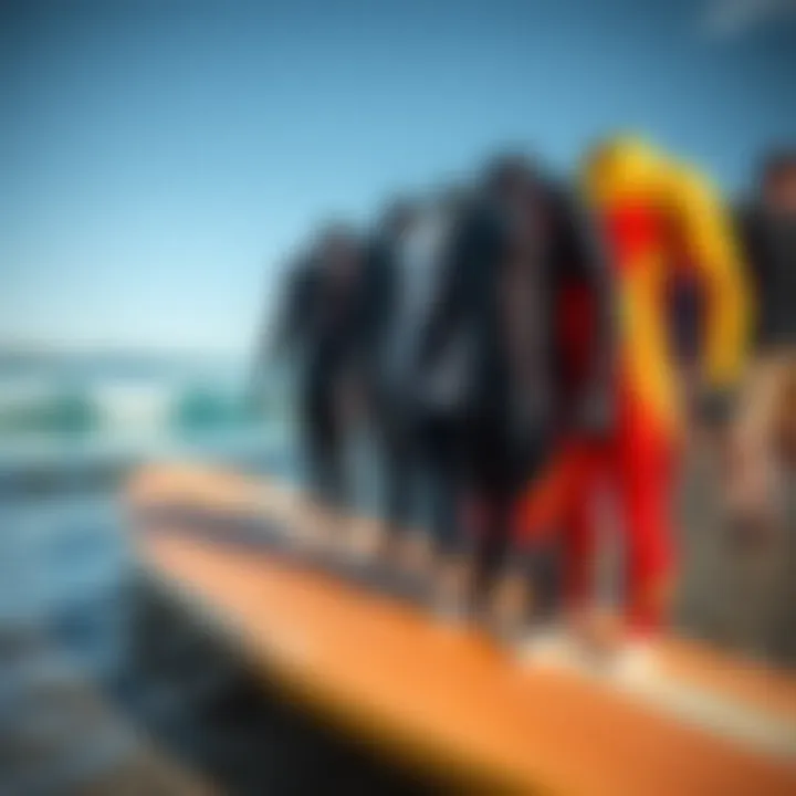 Wetsuit Comparison: Fit and Style Diverse range of wetsuits displayed on a surfboard for comparison of fit and style