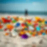 Colorful collection of beach glass displayed on a sandy surface