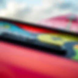 A close-up view of the Odysea foam surfboard showcasing its unique design and vibrant colors.