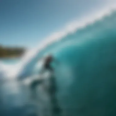 A surfer catching a wave in crystal-clear Caribbean waters