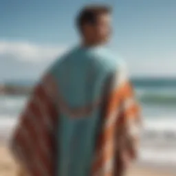 A surfer wearing a stylish poncho towel after a surf session