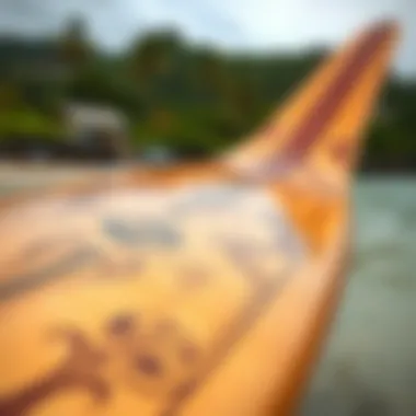 Close-up of a traditional Hawaiian surfboard showcasing intricate designs.