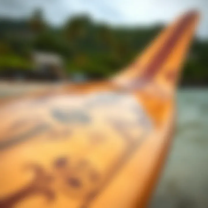 Close-up of a traditional Hawaiian surfboard showcasing intricate designs.