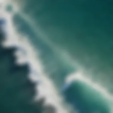 An aerial view of the vibrant waves at Lahaina's shoreline