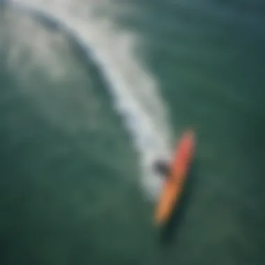 An aerial view of surfers catching waves at a popular surf spot