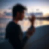 A surfer using a GPS tracker on the beach