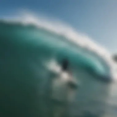 Surfers riding waves at Padang Padang Beach