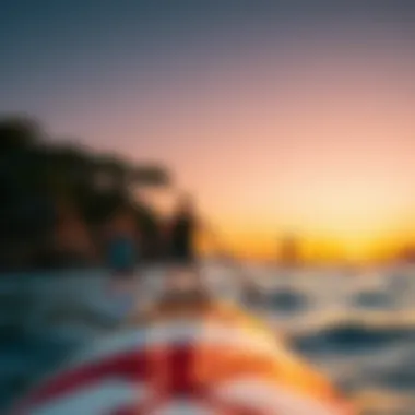 Scenic view of paddle boarders enjoying sunset