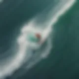 Aerial view of a surfer riding a massive wave