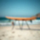 Portable surfboard stand on a sandy beach