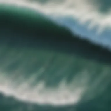 An aerial view of a famous surf spot in California, highlighting its waves and surfers.