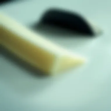 Understanding Surfboard Materials Close-up of surfboard materials highlighting foam and fiberglass.