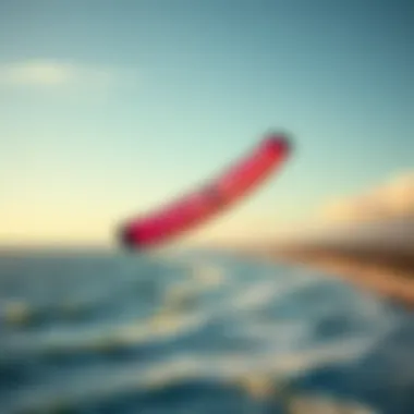 A vibrant kite soaring above an expansive ocean coastline