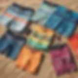 A vibrant selection of boardshorts displayed on a sandy beach