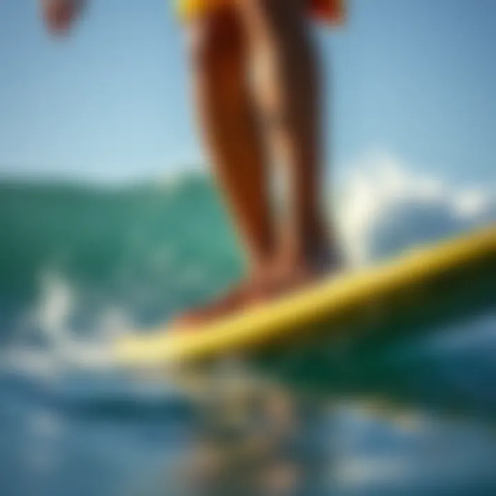 Close-up of a surfer's feet executing the hang ten on a surfboard