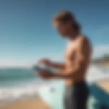 Surfer Utilizing Wind Forecast Technology Surfer checking wind forecast on a mobile device
