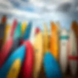 Colorful array of used surfboards displayed on a beach