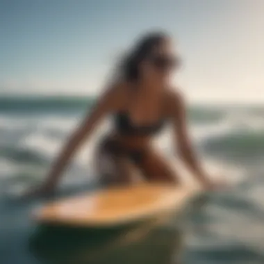 Visually impaired surfer engaging with a Braille fingerboard in the ocean