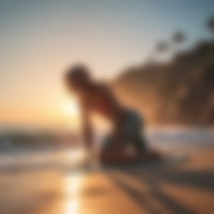 A surfer practicing a yoga pose on the beach at sunrise